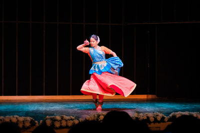 Woman standing on stage