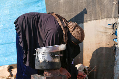 Rear view of man wearing hat