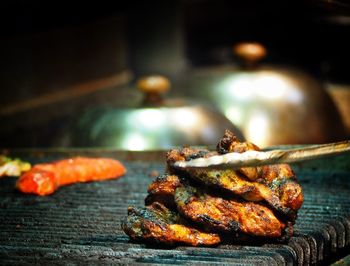 Close-up of meat on barbecue grill