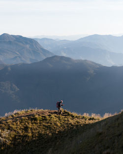 Man on mountain against sky