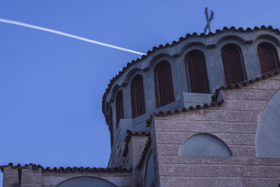 Low angle view of castle against clear blue sky