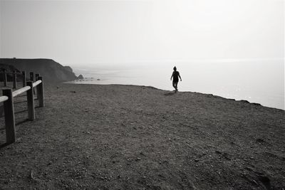 Full length of a man walking on beach