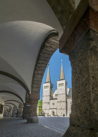 Archway of historic building against sky