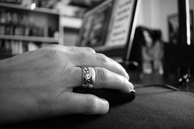 Close-up of woman with ring using laptop