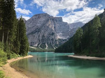 Scenic view of lake and mountains against sky