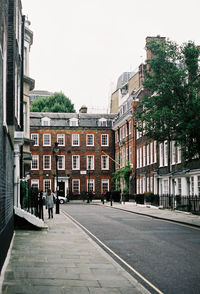 Street in city against clear sky