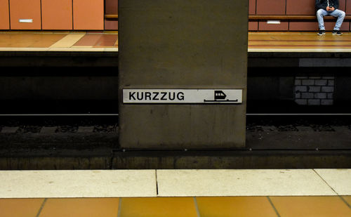 Text on railroad station platform
