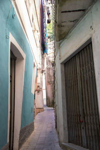 Alley amidst buildings in city