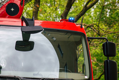 Close-up of red vintage car on land