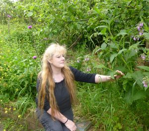 Portrait of young woman in grass