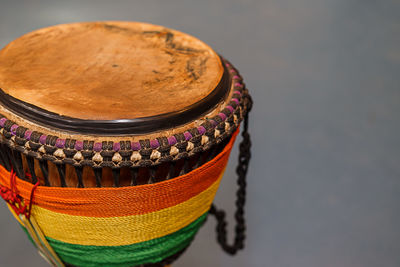 High angle view of colorful drum against gray background