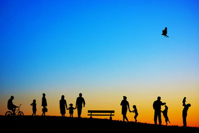 Silhouette people at sunset