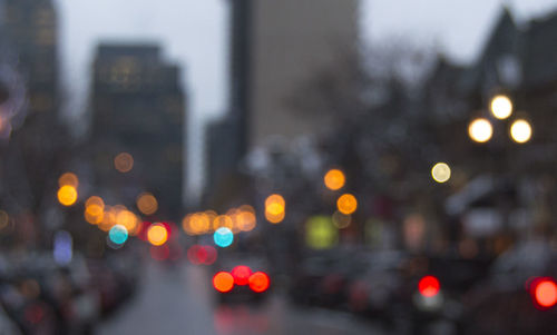 Defocused image of illuminated city at night