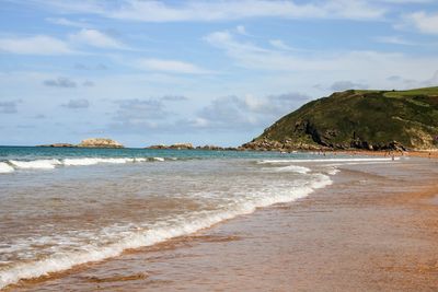 Scenic view of beach against sky