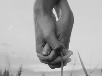 Cropped hand of man holding cigarette