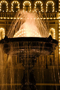 Reflection of illuminated lights in water at night