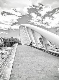 Man in city against sky