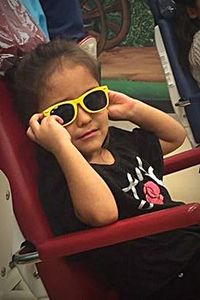 Close-up portrait of a boy in sunglasses