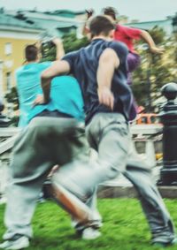 Rear view of people walking outdoors