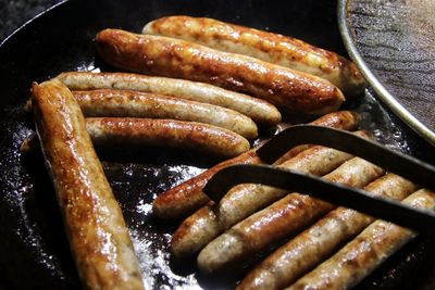 High angle view of meat on barbecue grill