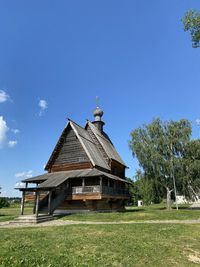 Built structures on field against sky