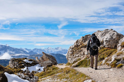 Rear view of man hiking european alps