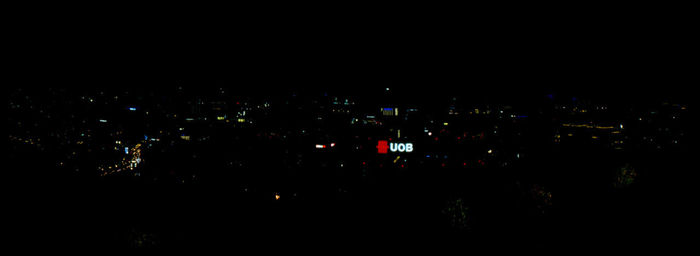 High angle view of illuminated buildings in city at night