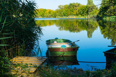 Scenic view of lake and trees against sky