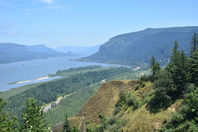 Scenic view of landscape and mountains against sky