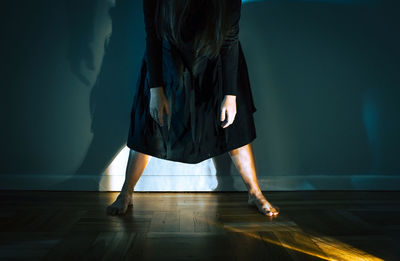 Low section of woman standing on floor