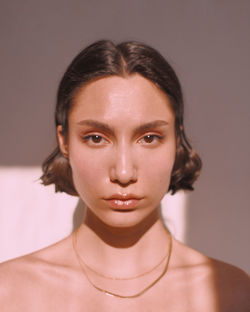 Close-up portrait of a serious young woman