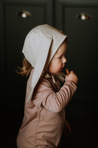 Toddler baby girl in funny hat with ears having fun