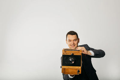 Portrait of young man against white background