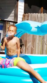 Portrait of boy playing with toy