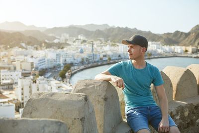 Man looking away against mountains