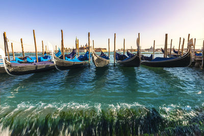 Boats moored in canal