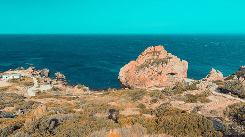 Scenic view of sea against clear blue sky