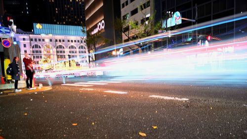 Light trails on street in city at night