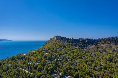 Scenic view of sea against clear blue sky