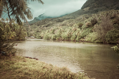 Scenic view of lake and mountains against sky