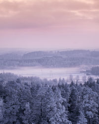 Scenic view of landscape against sky during winter