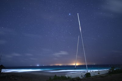 Scenic view of sea against sky at night