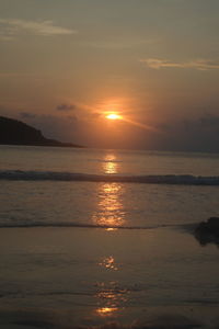 Scenic view of sea against sky at sunset