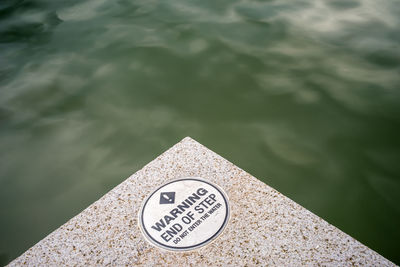 Close-up of text on water