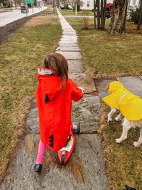 Rear view of girl on road