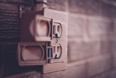 Close-up of electrical outlet on wall