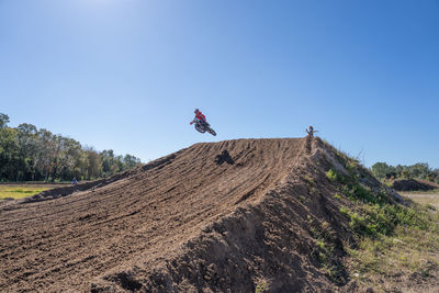 Motocross riders practiing tricks at the orlando mx park in orlando, florida open to the public