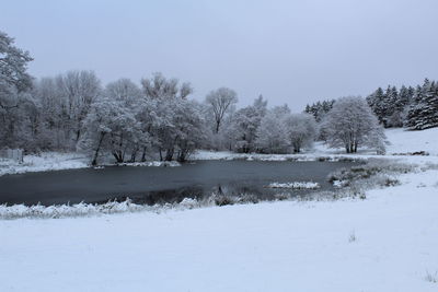 Scenic view of frozen lake against clear sky