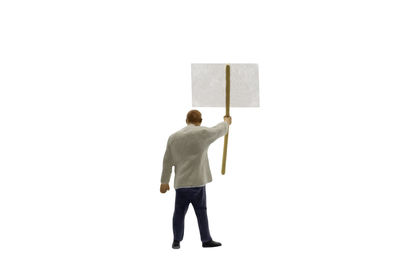 Rear view of man standing against white background