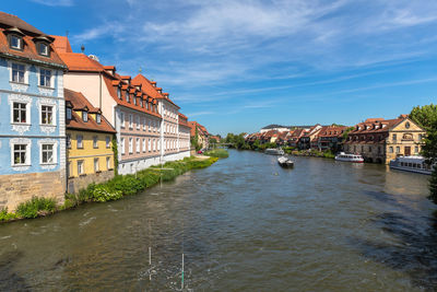 River amidst buildings in town